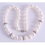 A SILVER AND PEARL LADIES NECKLACE with diamond studs. 42 cm long.