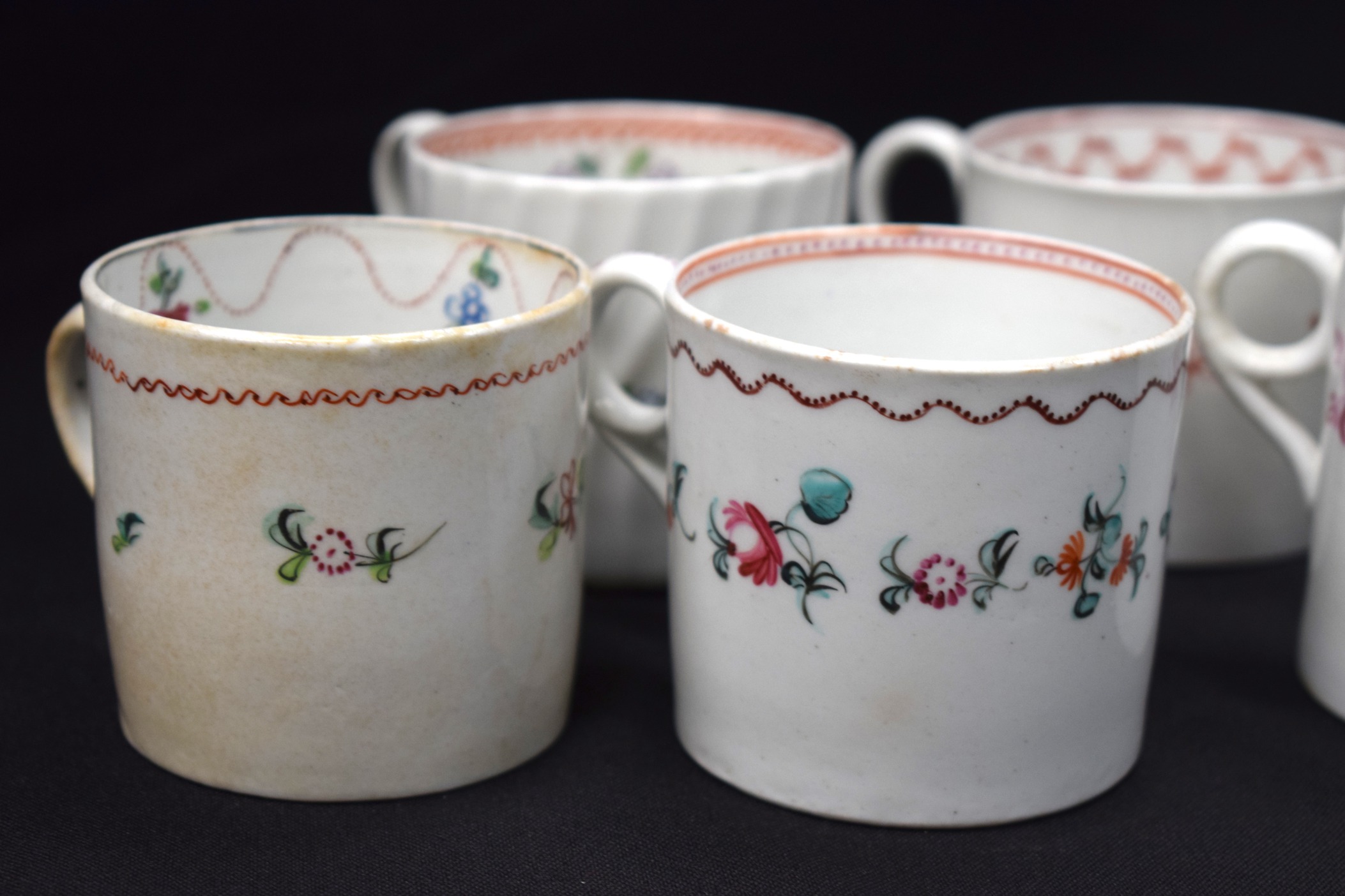 A GROUP OF NINE GOOD NEW HALL PORCELAIN COFFEE CUPS, of varying pattern. - Image 2 of 4