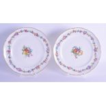 Sèvres lobed plates with moulding at the rims, painted with a central colourful spray of fruits