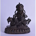 AN 18TH/19TH CENTURY TIBETAN BRONZE FIGURE OF A GOD modelled seated upon a buddhistic lion, upon