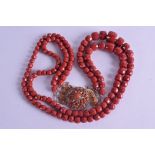 AN 18CT GOLD MOUNTED CARVED RED CORAL NECKLACE. 170 grams. 70 cm long. Largest bead 1.25 cm x 1.5