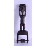 AN AFRICAN CARVED TRIBAL HARDWOOD PULLEY. 26.5 cm long.