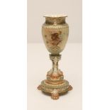 A ROYAL WORCESTER CHINA VASE, 1906, the lobed ovoid body with mask moulded and scroll pierced rim,