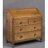 A ROBERT THOMPSON ADZED OAK BUREAU, the fall front enclosing interior with shelves and pigeon holes,