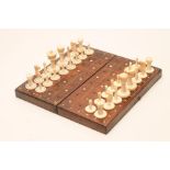 AN ANGLO INDIAN IVORY CHESS SET, late 19th century, all natural, one set with two turned and black