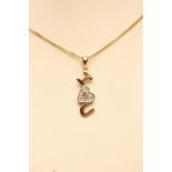 A 9CT GOLD PENDANT, the central heart millegrain set with eight small diamonds and reading "I Love
