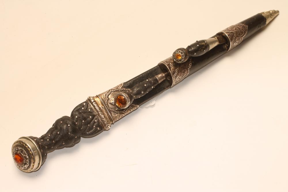 A SCOTTISH DIRK, 19th century, the fullered blade with serrated back edge, shaped wood grip