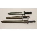 A US M1917 BAYONET, with two piece plastic grip and plastic scabbard, together with two M1 bayonets,
