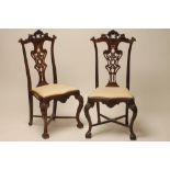A SET OF FOUR COLONIAL ROSEWOOD(?) SIDE CHAIRS, 19th century, the shaped reeded uprights and pierced