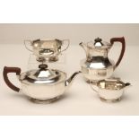 A THREE PIECE SILVER TEA SERVICE, makers Adie Bros., Birmingham 1933, of octagonal form with cast