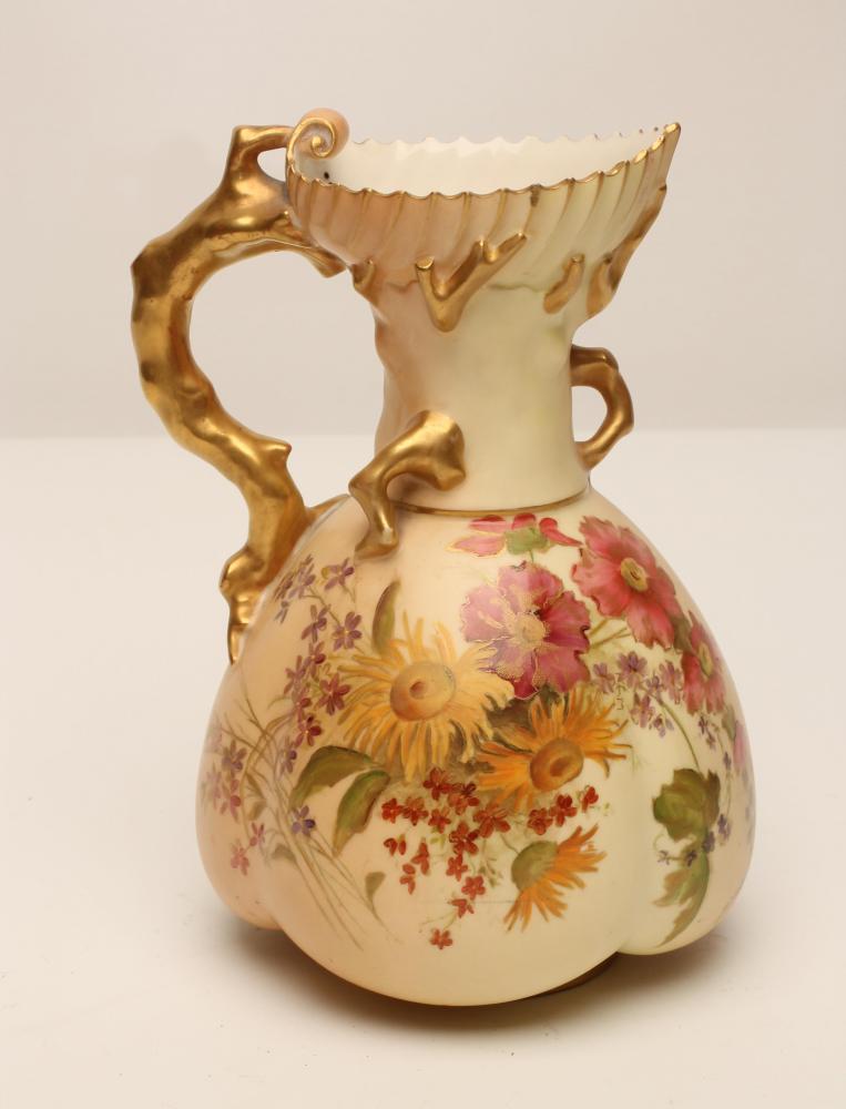 A ROYAL WORCESTER CHINA JUG, 1903, of lobed form with coral twig handle, painted in polychrome
