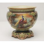 A ROYAL WORCESTER CHINA SMALL JARDINIERE, 1905, of circular form with four foliate strapwork moulded