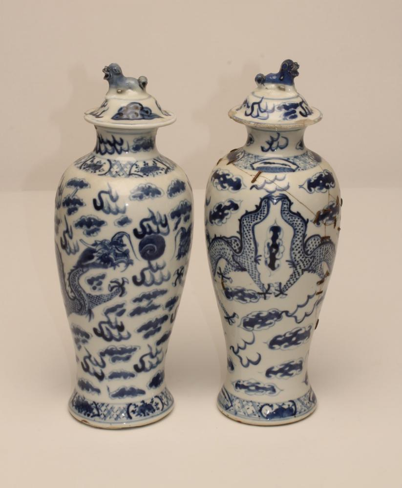 A PAIR OF CHINESE PORCELAIN VASES AND COVERS, of inverted baluster form, painted in underglaze