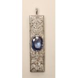 A SAPPHIRE AND DIAMOND PENDANT, the 18kt white gold open oblong frame centred by a claw set oval