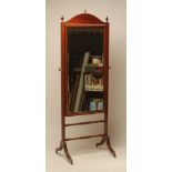 AN EDWARDIAN MAHOGANY CHEVAL MIRROR, with stringing and satinwood banding, the bevelled oblong plate