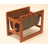 A TEAK AND BROWN LEATHER MAGAZINE RACK of open frame oblong form with central division, the