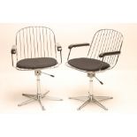 A PAIR OF CHROME FRAMED SWIVEL CHAIRS, 1960's/70's, the adjustable wire work seat with mildly arched