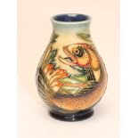 A MOORCROFT POTTERY SMALL VASE, modern, of baluster form tubelined and painted in typical palette