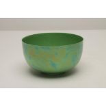 A RUSKIN PORCELAIN BOWL, 1922, of plain circular form in an iridescent apple green "orange peel"