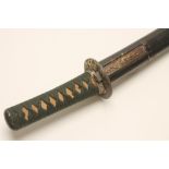 A JAPANESE MEIJI PERIOD WAKIZASHI, the 17 1/2" curved blade with undulating hamon and signed tang,