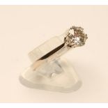 A SOLITAIRE DIAMOND RING, the brilliant cut stone of approximately 0.85cts, claw set to a plain 18ct