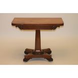 AN EARLY VICTORIAN POLLARD OAK FOLDING CARD TABLE of rounded oblong form, the swivel top opening