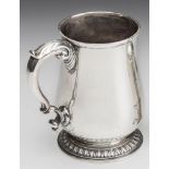 A GEORGE II SILVER MUG, maker probably Thomas Gilpin, London 1747, of baluster form on a straight