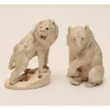 TWO JAPANESE IVORY MODELS, c.1920's, one carved as a seated bear, his right paw resting on a