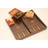A ROSEWOOD FOLDING GAMES COMPENDIUM, early 19th century, the hinged board inlaid in ebony and