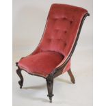 A VICTORIAN ROSEWOOD FRAMED NURSING CHAIR of Grecian design, button upholstered in pink dralon, leaf