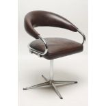 A CHROME FRAMED AND BROWN LEATHER SWIVEL CHAIR, 1960's/70's, the arched open padded back extending
