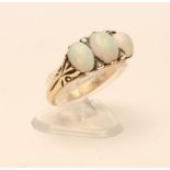 A LATE VICTORIAN OPAL RING, the three cabochon polished stones with rose cut diamond points