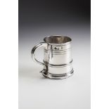 A QUEEN ANNE BRITANNIA STANDARD SILVER MUG, maker Joseph Ward, London 1710, of plain single