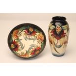A MOORCROFT POTTERY BOWL AND VASE, modern, both of plain form, tubelined and painted in typical