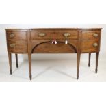 A GEORGIAN MAHOGANY SIDEBOARD, late 18th century, of mildly bowed form with stringing, frieze drawer