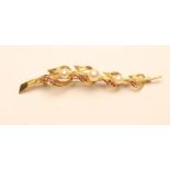 AN 18CT GOLD SPRAY BROOCH, of stylised form, peg set with three graduated pearls and four pairs of