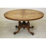 A VICTORIAN WALNUT LOO TABLE, the moulded edged tip up top quarter veneered with marquetry floral