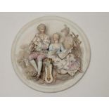 A GERMAN BISQUE PORCELAIN PLAQUE, late 19th century, the roundel moulded in high relief with a