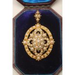 A VICTORIAN PEARL AND DIAMOND PENDANT/BROOCH, the open oval panel centred by a stylised flowerhead