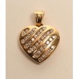 A DIAMOND PENDANT, the 14ct gold heart with six open panels channel set with graduated stones, to