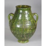 A SUFI'S STONEWARE WATER JUG, of irregular ribbed baluster form with two pulled and applied