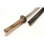 A JAPANESE EARLY EDO PERIOD CIVILIAN WAKIZASHI, 23 1/4" curved blade with hamon, tsuba with