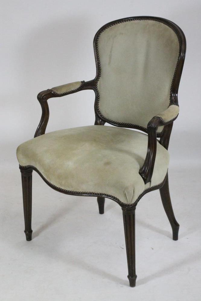 A GEORGIAN MAHOGANY FRAMED OPEN ARMCHAIR, late 18th century, in the French taste and upholstered