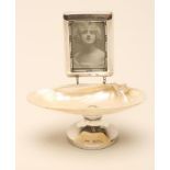 A SILVER DRESSING TABLE STAND, makers W. Vale & Sons, Chester 1922, the polished shell bowl