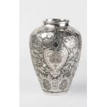 A CHINESE SILVER VASE of flared rounded cylindrical form with sloping shoulders, profusely chased