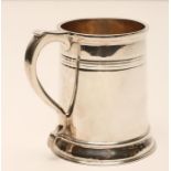 A SILVER MUG, makers Stokes & Ireland, Chester 1929, of plain tapering cylindrical form with a