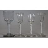 FOUR GEORGIAN AND LATER WINE GLASSES, all with multi-ply opaque twist stems, one with white