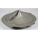 A LIBERTY & CO. PLANISHED PEWTER MUFFIN DISH AND COVER, c.1910, of shaped circular form, the swept