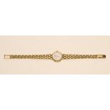 A LADY'S LONGINES 18CT GOLD WRISTWATCH, the circular white dial inset with diamond "dot" markers