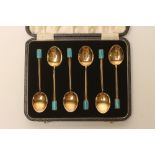 A SET OF SIX ART DECO SILVER GILT COFFEE SPOONS, maker Israel S. Greenberg, with turquoise enamelled